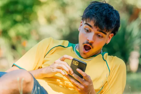 Young Man Mobile Phone Surprised Expression Field Stock Image