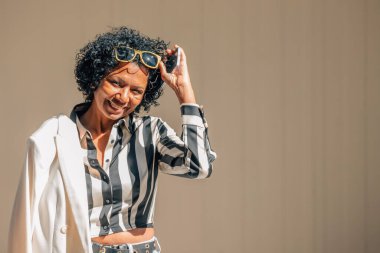 urban woman with sunglasses on the street clipart