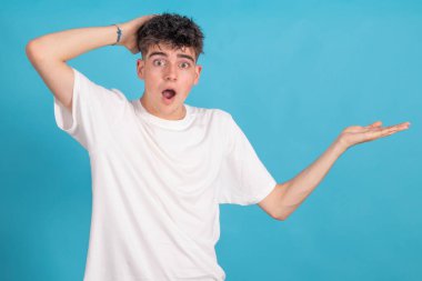 teenage student isolated on background pointing