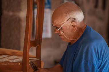 upholsterer craftsman working in the workshop clipart