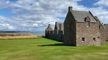 Dunnottar Castle is a ruined medieval fortress located upon a rocky headland on the north-eastern coast of Scotland, about 2 miles south of Stonehaven