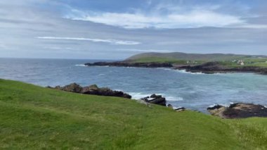 Amazing Clachtoll Beach in Lochinver, Scotland. Clachtoll Beach is a popular beach with some rugged terrain, including the Split Rocks