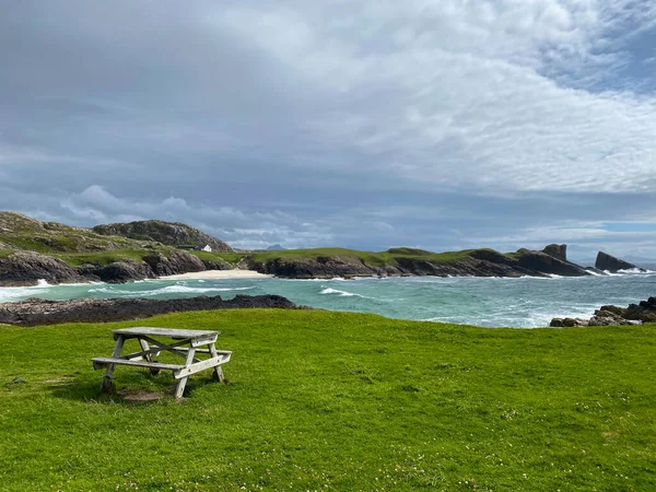 Amazing Clachtoll Beach in Lochinver, Scotland. Clachtoll Beach is a popular beach with some rugged terrain, including the Split Rocks