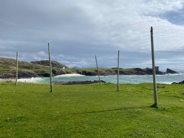 Amazing Clachtoll Beach in Lochinver, Scotland. Clachtoll Beach is a popular beach with some rugged terrain, including the Split Rocks