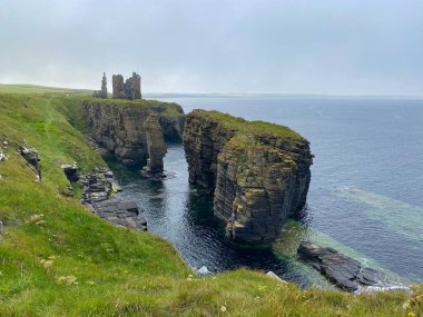 Ruins of Castle Sinclair Girnigoe, Scotland. It is located about 3 miles north of Wick on the east coast of Caithness, Scotland. It is considered to be one of the earliest seats of Clan Sinclair. clipart