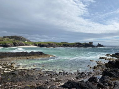 Amazing Clachtoll Beach in Lochinver, Scotland. Clachtoll Beach is a popular beach with some rugged terrain, including the Split Rocks clipart