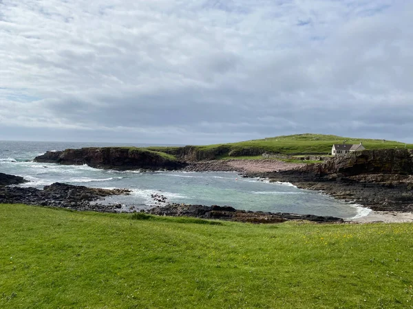 Amazing Clachtoll Beach in Lochinver, Scotland. Clachtoll Beach is a popular beach with some rugged terrain, including the Split Rocks