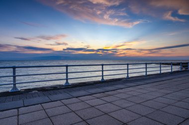 End of the day on the promenade in Aberystwyth. It is a seaside resort with a long promenade, and is situated on the Welsh coast. clipart