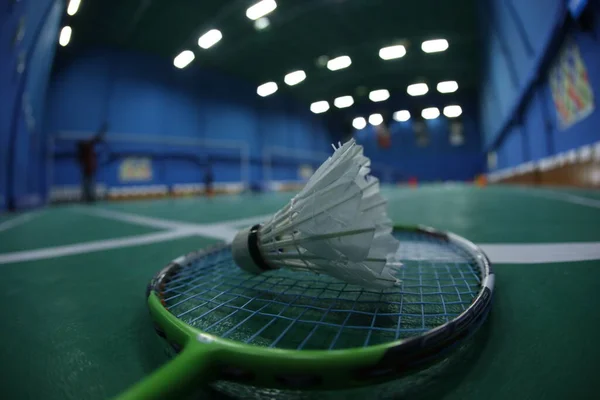 Badminton White Feather Shuttle On court