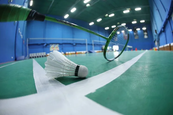 Badminton White Feather Shuttle On court