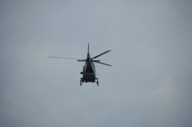 Helicopter flying close to earth