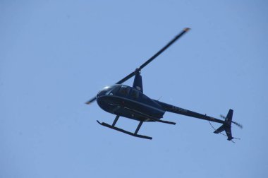 Helicopter flying close to earth