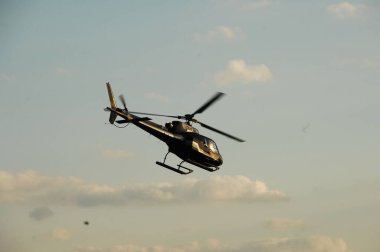 Helicopter flying close to earth