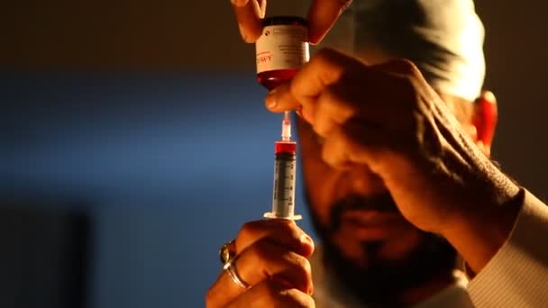 Doctor Prepares Needle Injects Patient — Stock Video