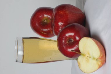 Apple juice in the glass Studio shot clipart