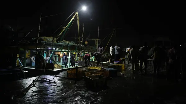 stock image Indian Fishermen working at Night