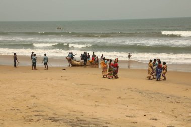 Tourists in a Beach Kakinada India clipart