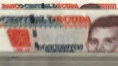 Cuba money Cuban Peso money counting machine with banknotes. Quick 200 CUP currency note down rotation. Business and economy. Concept loopable and seamless background.