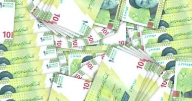 Iran Rial banknotes in a cash fan mosaic pattern loop. Iranian IRR 10000 notes. Abstract concept of bank, finance, economy seamless and looped decorative design background.