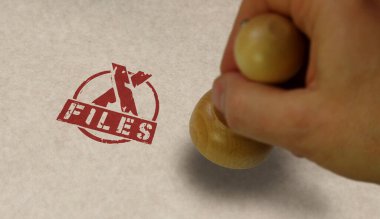 X Files stamp and stamping hand. Secret mystery investigation and conspiracy concept.