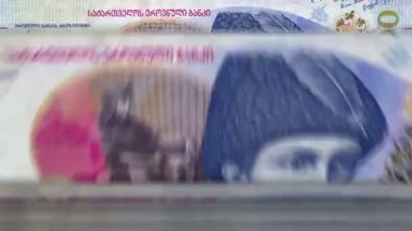 Georgia money Georgian Lari money counting machine with banknotes. Quick 100 GEL currency note down rotation. Business and economy. Concept loopable and seamless background.