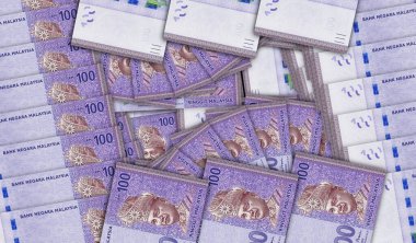 Malaysia Ringgit banknotes in a cash fan mosaic pattern. Malaysian 100 MYR notes. Abstract concept of bank, finance, economy decorative design background 3d illustration.