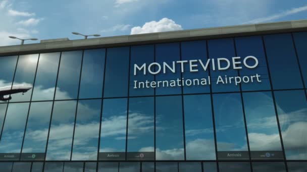 ウルグアイのモンテビデオでの飛行機着陸3D ガラス空港ターミナルとジェット機の反射で街に到着 ビジネス 交通の3Dコンセプト — ストック動画