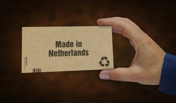荷兰制造的盒子在手 制造和交付 产品工厂 进出口 抽象概念3D渲染说明 — 图库照片