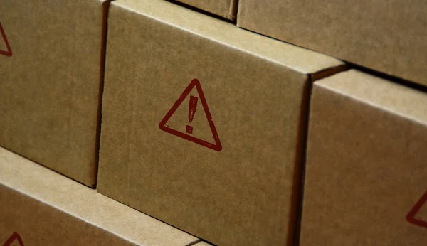 Alert stamp printed on cardboard box. Danger alarm, security warning caution and attention concept.