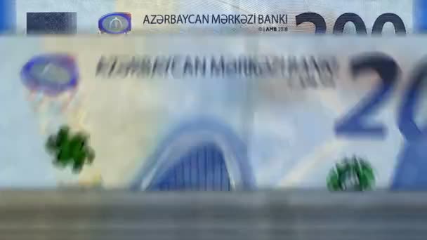阿塞拜疆货币阿塞拜疆马纳特的货币计数机与钞票 快速200 Azn纸币向下旋转 商业和经济 概念上的漏洞和无缝背景 — 图库视频影像