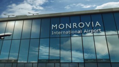 Monrovia, Liberya 3D 'ye uçak iniyor. Cam havaalanı terminali ve jet uçağının yansımasıyla şehre vardık. Seyahat, iş, turizm ve ulaşım 3D konsepti.