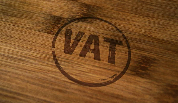 VAT stamp printed on wooden box. Value-added tax and invoice payment concept.