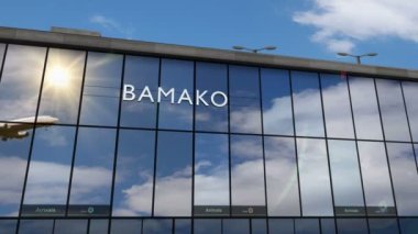 Uçak Bamako, Mali 3D 'ye iniyor. Cam havaalanı terminali ve jet uçağının yansımasıyla şehre vardık. Seyahat, iş, turizm ve ulaşım 3D konsepti.
