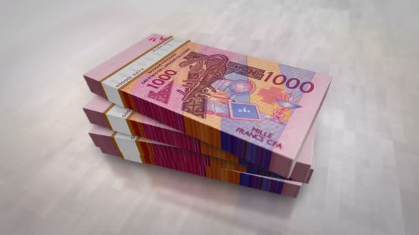西アフリカCfaのお金フランニジェールマリセネガルアフリカパイルパック ビジネス 景気後退 金融のコンセプトの背景 1000 Xof紙幣スタック3D — ストック動画