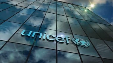 New York, New York, 10 Kasım 2023: UNICEF organizasyon genel merkezi logo cam döngüsü hızlandırma kavramı. Birleşmiş Milletler Çocuk Fonu sembolü 3D pürüzsüz ve çevrilebilir.