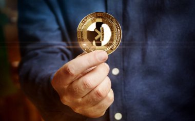 Poznan, Poland, September 1, 2024: Kaspa KAS cryptocurrency golden coin in hand abstract concept clipart