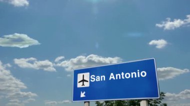 San Antonio Teksas ABD Jet uçağı iniyor. Havaalanı istikameti işaretli şehir gelişi. Seyahat, iş, turizm ve uçak taşımacılığı kavramı.