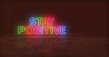 Pozitif motivasyon sloganı olarak Neon sembolü kal. Renkli ampuller. Espri ve mutlu ruh hali soyut, kusursuz ve döngüsel bir kavram. 3D tünel animasyonunda uçuyor..