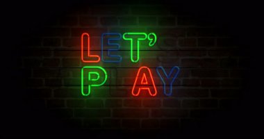 Tuğla duvarda neon oyun sembolü oynayalım. Hadi renkli ampullerle oynayalım. Döngüsüz ve kusursuz soyut konsept animasyonu.