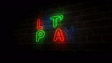 Tuğla duvarda neon oyun sembolü oynayalım. Hadi oyun oynayalım açık renkli ampuller soyut konsept.