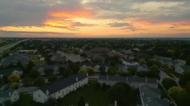 Drone view of american suburb at summertime. Establishing shot of neighborhood. . High quality 4k footage