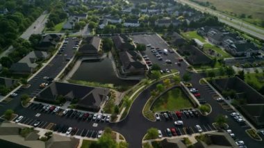 Drone view of american suburb at summertime. Establishing shot of neighborhood. . High quality 4k footage