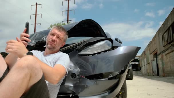 Mature Man Making Phone Call Car Accident Broken Car Background — Stock Video