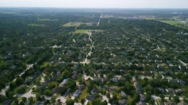 Drone view of american suburb at summertime. Establishing shot of neighborhood. . High quality 4k footage