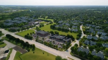 Drone view of american suburb at summertime. Establishing shot of neighborhood. . High quality 4k footage