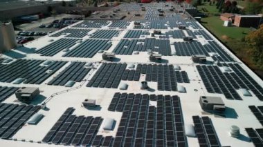 Drone flight fly over solar panels renewable green alternative energy on the roof . High quality 4k footage