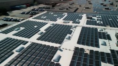 Drone flight fly over solar panels renewable green alternative energy on the roof . High quality 4k footage