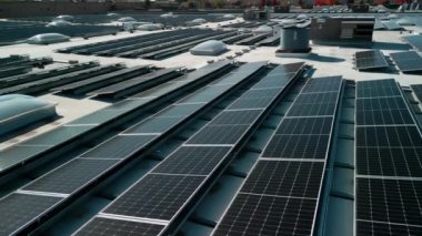 Drone flight fly over solar panels renewable green alternative energy on the roof . High quality 4k footage