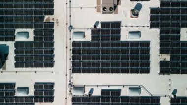 Drone flight fly over solar panels renewable green alternative energy on the roof . High quality 4k footage