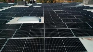 Drone flight fly over solar panels renewable green alternative energy on the roof . High quality 4k footage